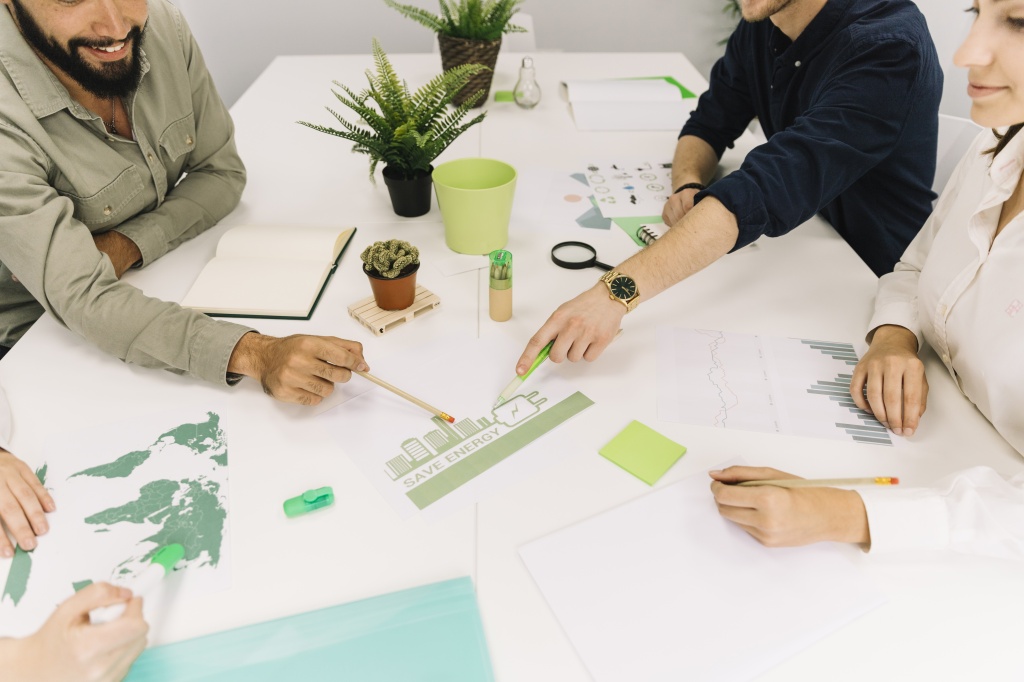 group-of-businesspeople-making-plans-on-energy-saving-at-workplace.jpg